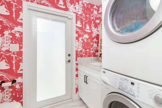 a utility room with dryer and washer