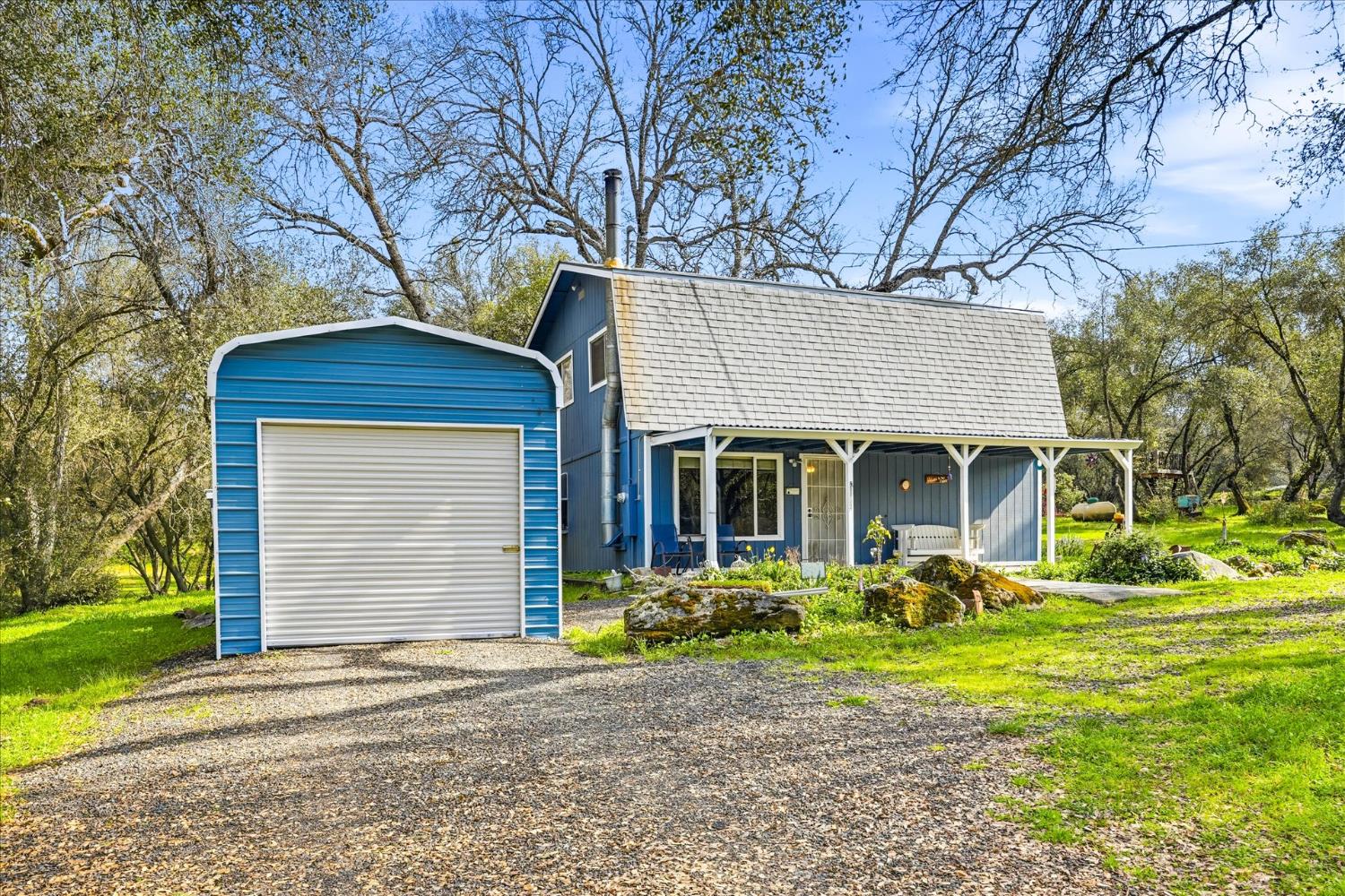 31325 Delaware Road Coarsegold, CA 93614 - Photo 22 of 39 a front view of a house with garden