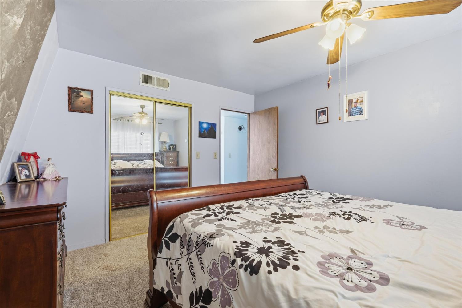 31325 Delaware Road Coarsegold, CA 93614 - Photo 34 of 39 a bedroom with a bed and a chandelier