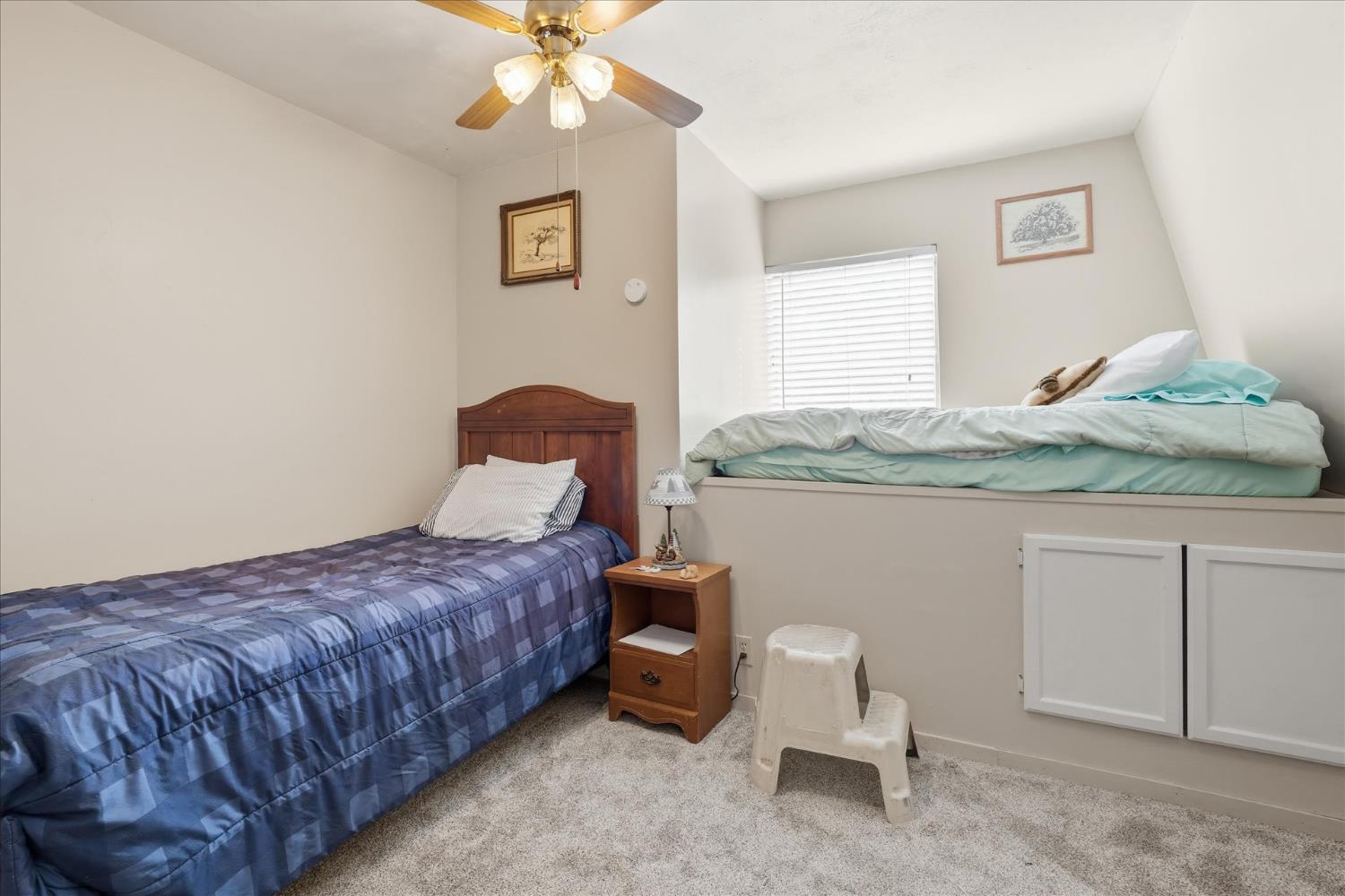 31325 Delaware Road Coarsegold, CA 93614 - Photo 36 of 39 a bedroom with a bed and a chandelier