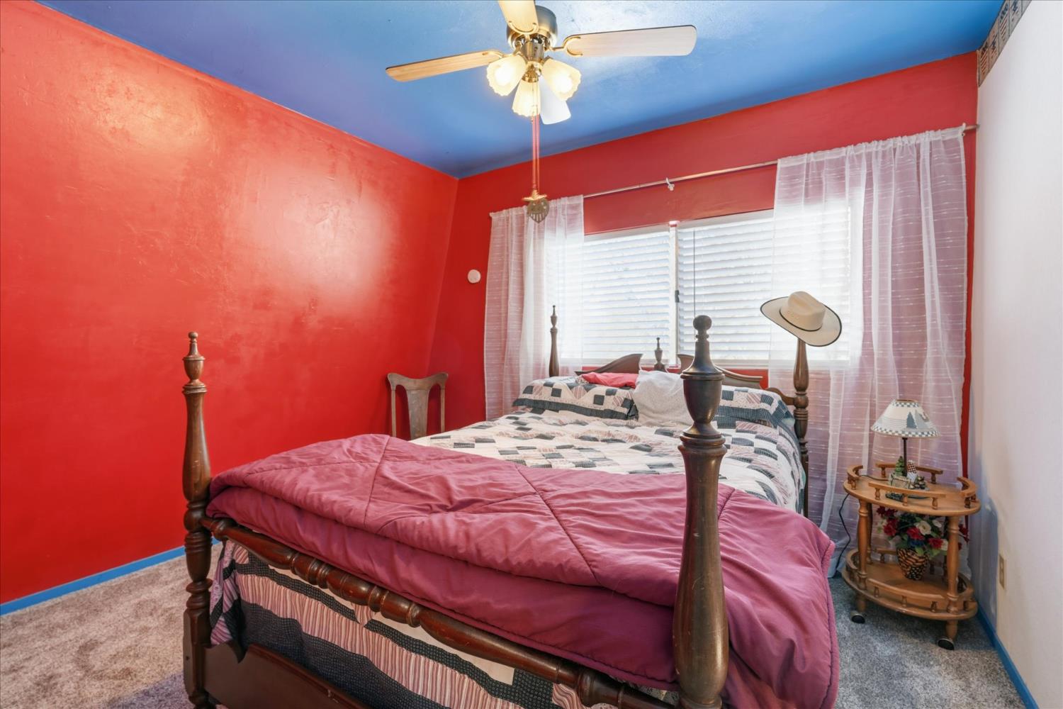 31325 Delaware Road Coarsegold, CA 93614 - Photo 37 of 39 a bed room with a bed and a chandelier