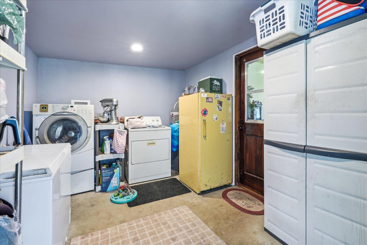 31325 Delaware Road Coarsegold, CA 93614 - Photo 7 of 39 a view of a storage & utility room with washer and dryer