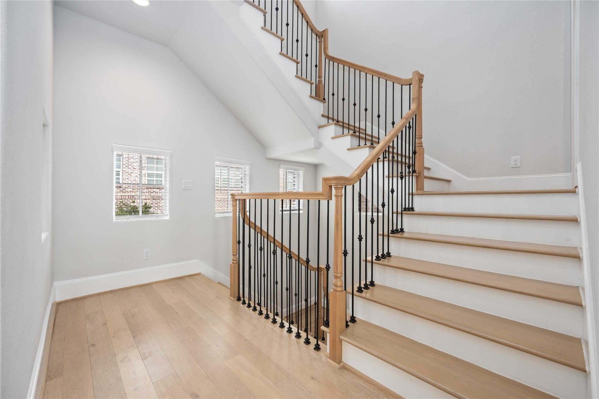 10919 Grove Tree Lane Houston, TX 77043 - Photo 12 of 43 a view of staircase with railing and white walls