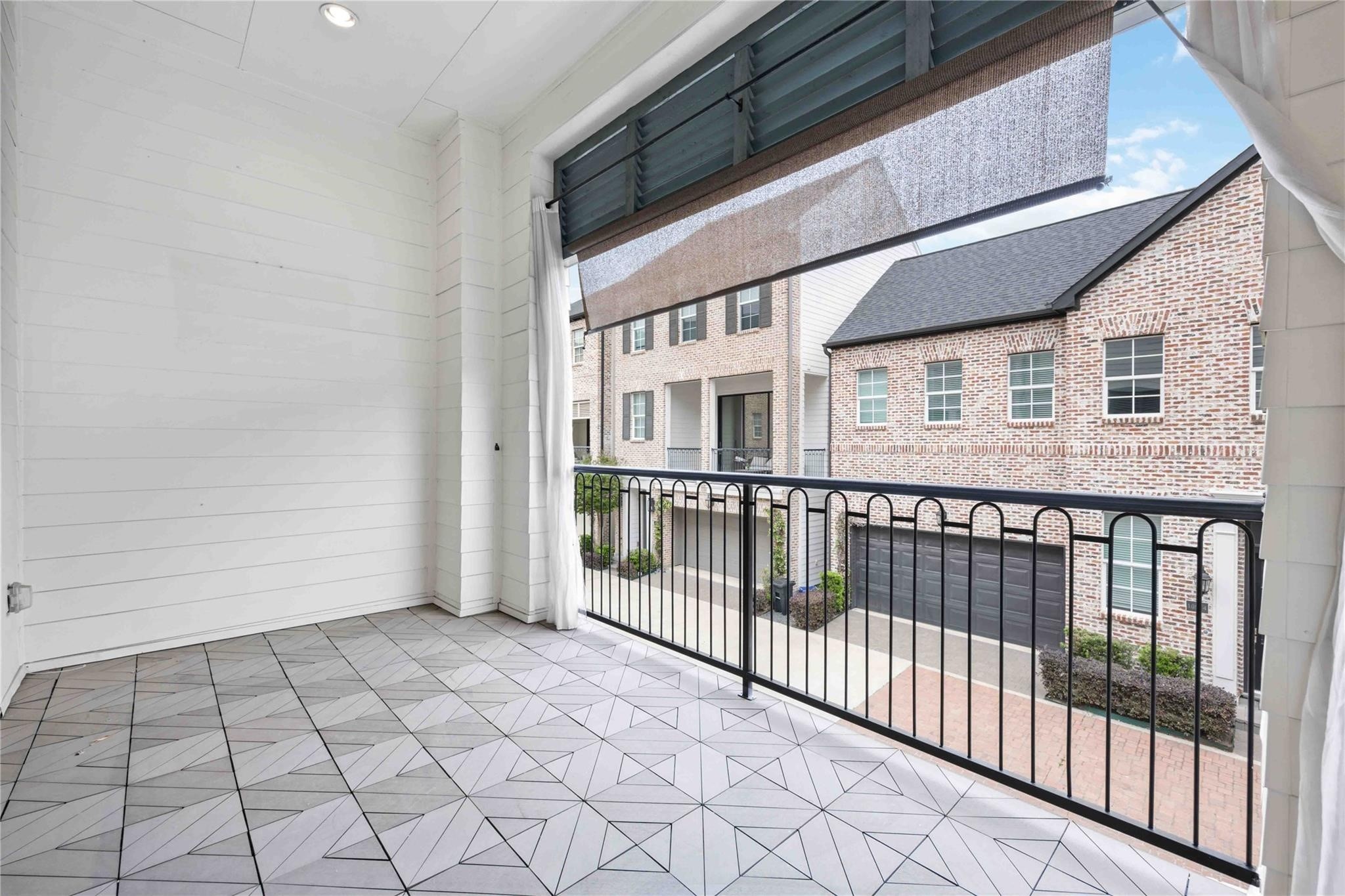 10919 Grove Tree Lane Houston, TX 77043 - Photo 18 of 43 a view of a brick house with wooden floor