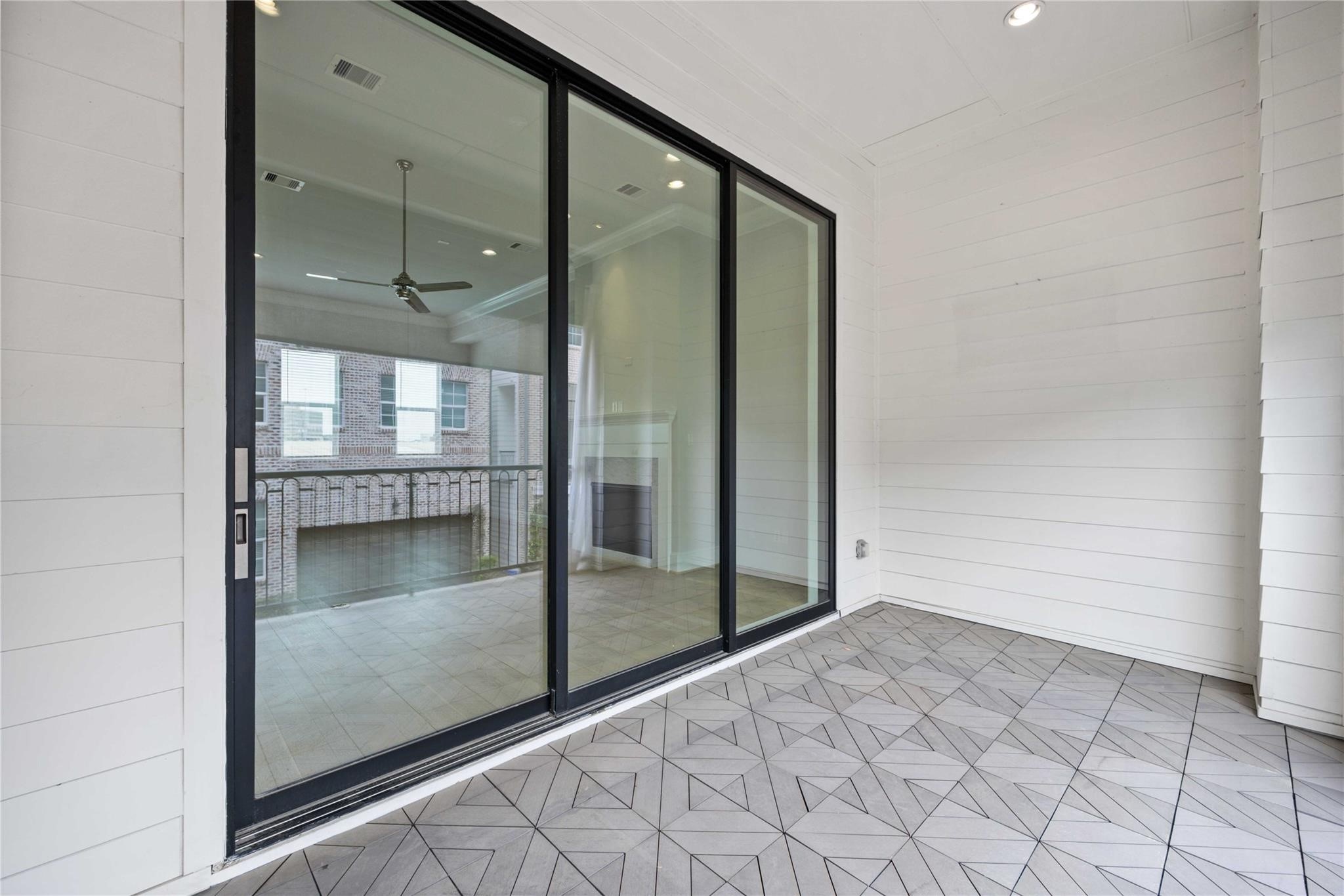 10919 Grove Tree Lane Houston, TX 77043 - Photo 19 of 43 a bathroom with a glass shower door