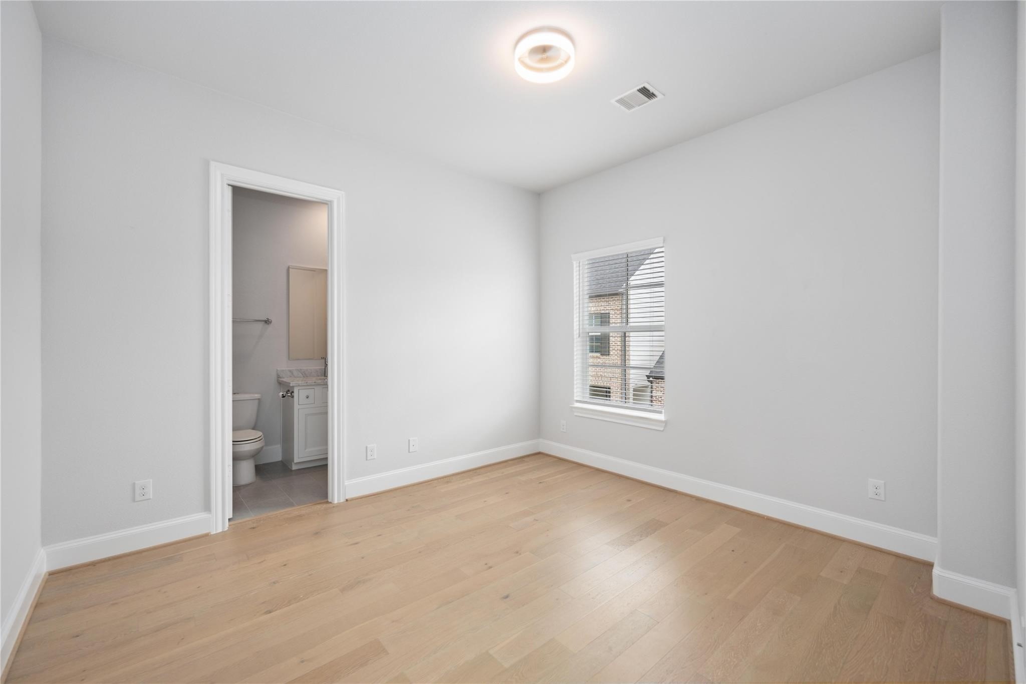 10919 Grove Tree Lane Houston, TX 77043 - Photo 20 of 43 a view of an empty room with a window