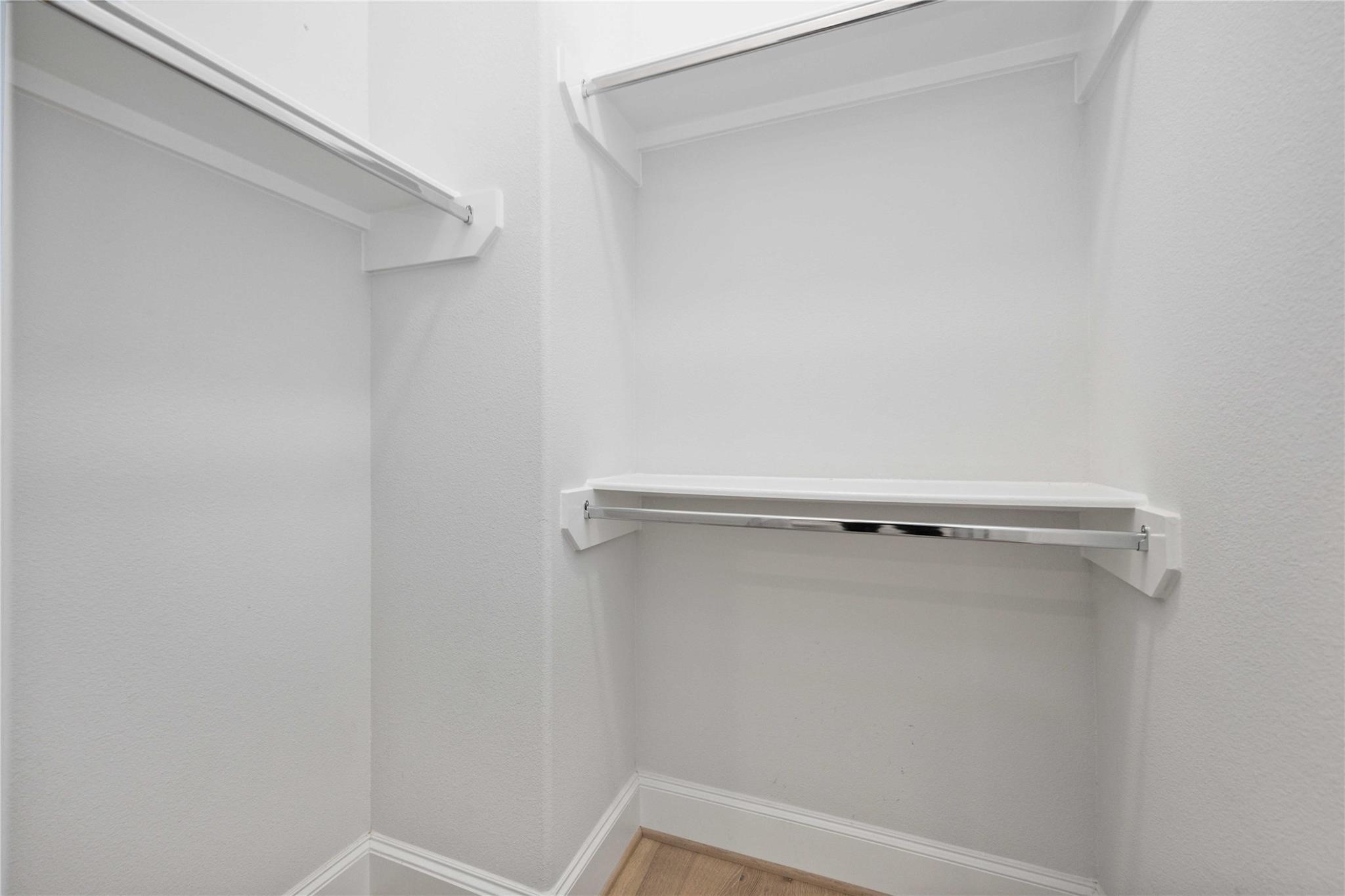 10919 Grove Tree Lane Houston, TX 77043 - Photo 23 of 43 a view of a room with racks on the wall