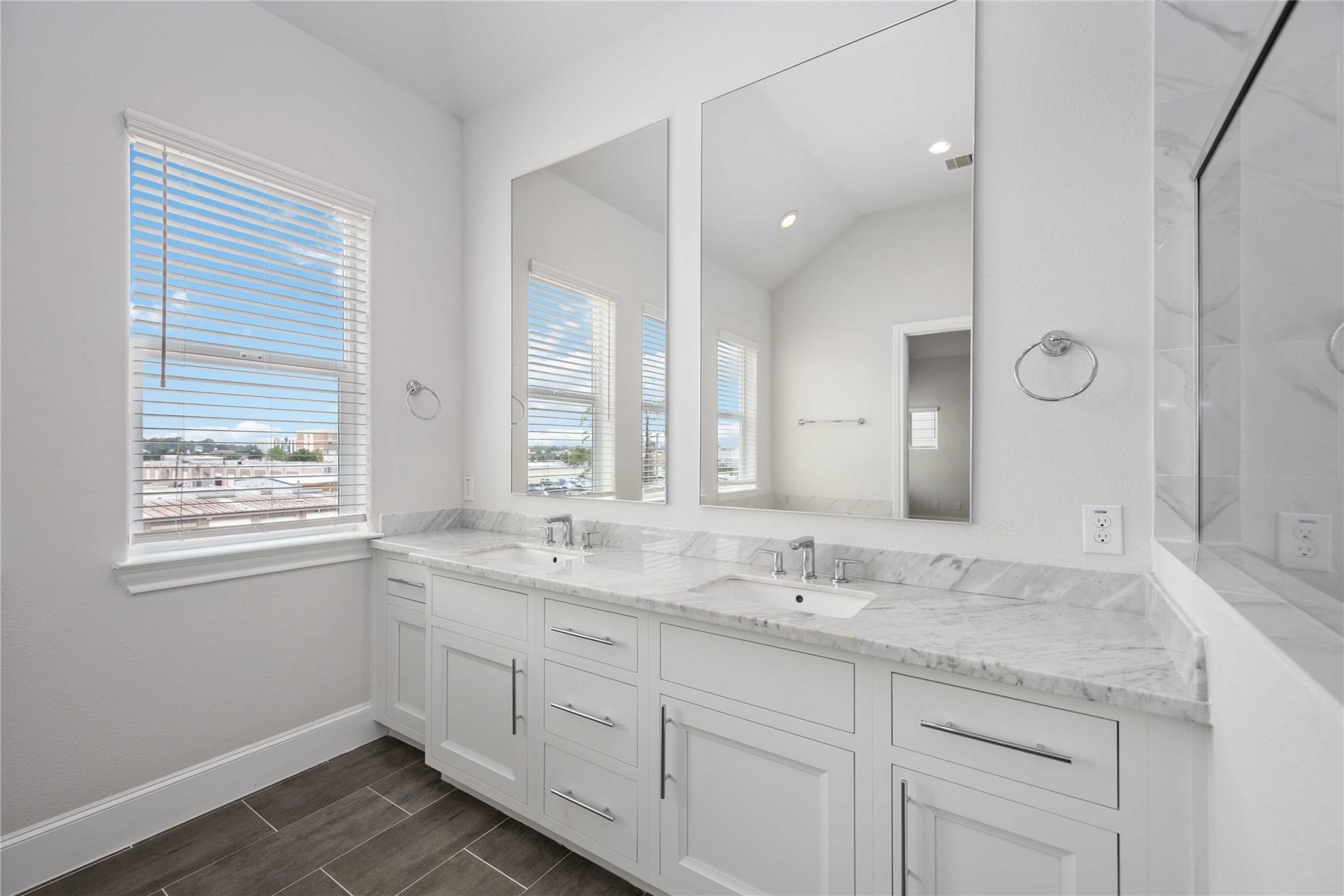 10919 Grove Tree Lane Houston, TX 77043 - Photo 29 of 43 a bathroom with a granite countertop sink mirror and double