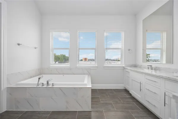 a bathroom with a bathtub and a sink