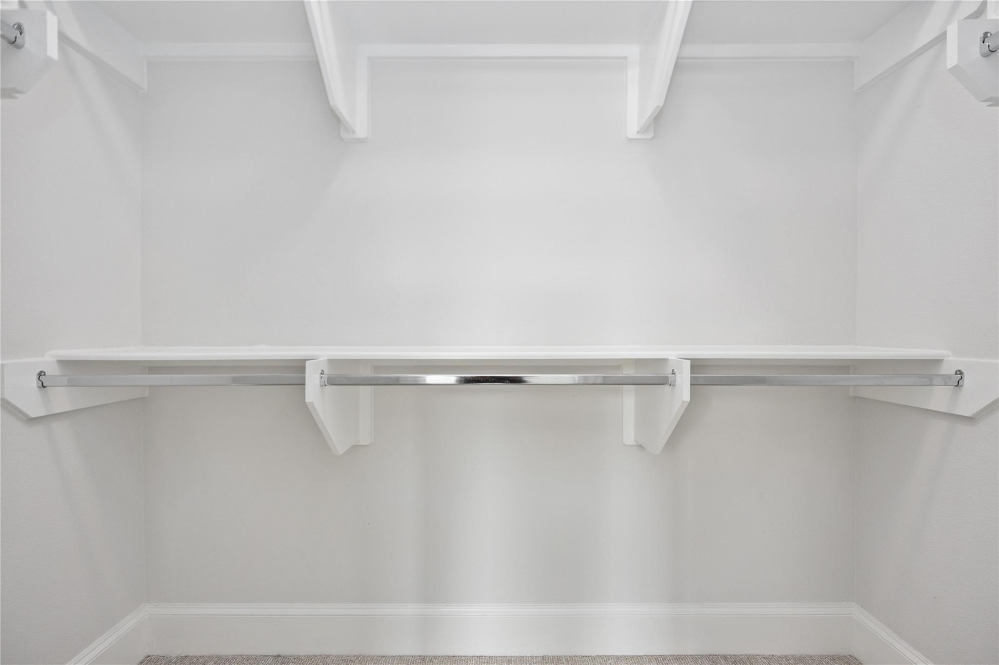 10919 Grove Tree Lane Houston, TX 77043 - Photo 9 of 43 a view of a room with racks on the wall