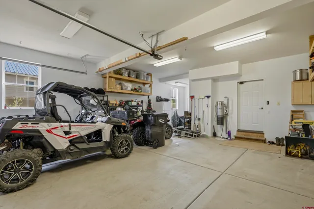a view of a garage with rack and bicycle