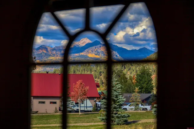 a view of swimming pool from a living room