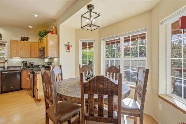 a view of a dining room with furniture window and outside view