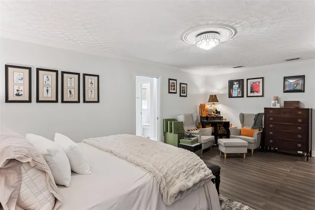 a bedroom with a bed and furniture