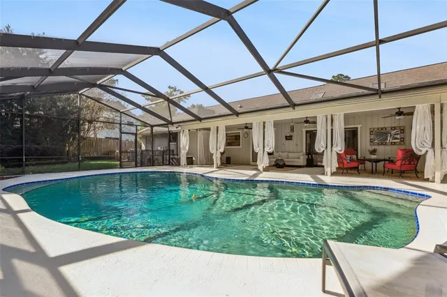 a view of a swimming pool with a patio