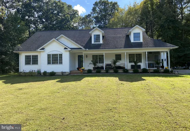 a front view of a house with swimming pool