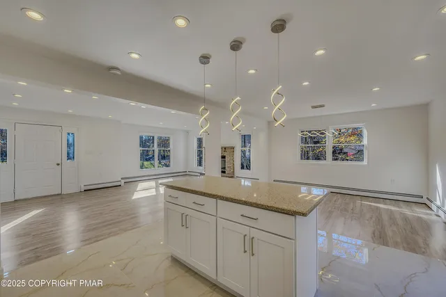 a view of center island in hallway