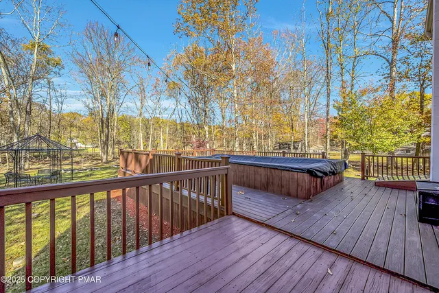 a view of balcony with wooden floor and outdoor space