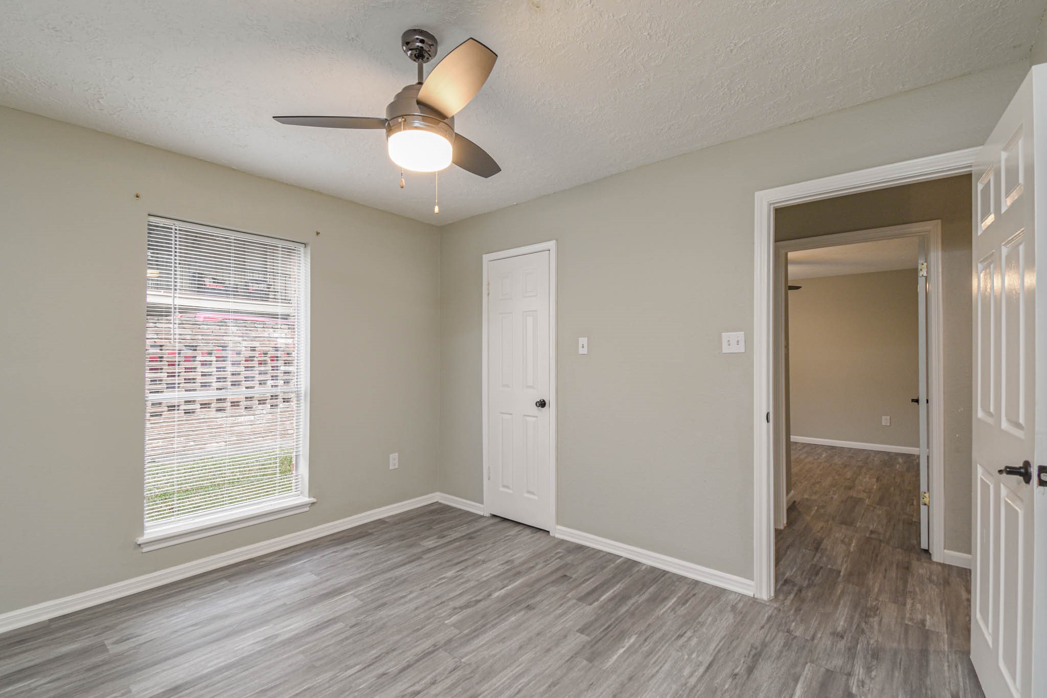 16911 Summit Oaks Lane Spring, TX 77379 - Photo 17 of 24 wooden floor in an empty room with a window