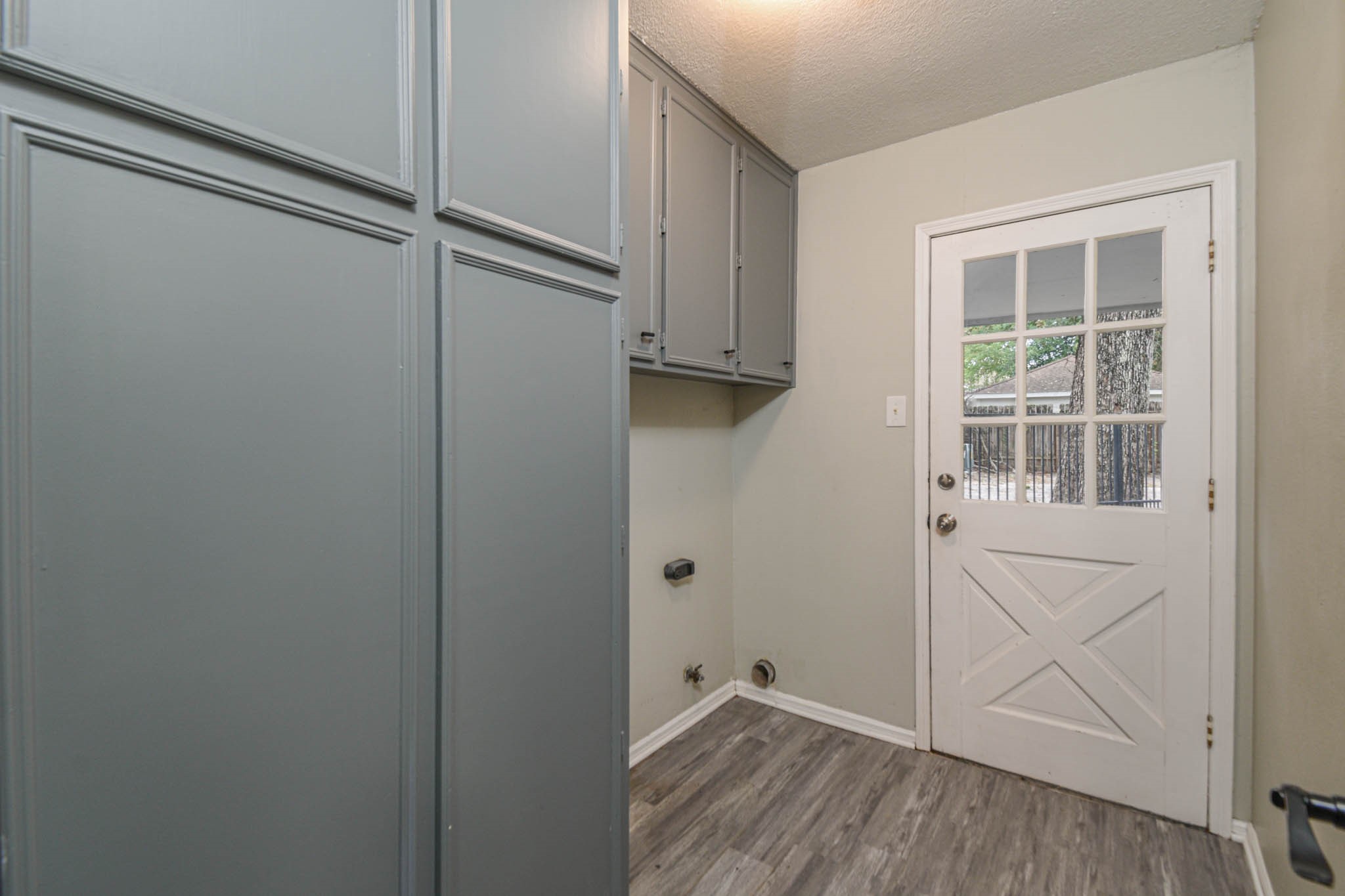 16911 Summit Oaks Lane Spring, TX 77379 - Photo 20 of 24 a view of an empty room with wooden floor and a window