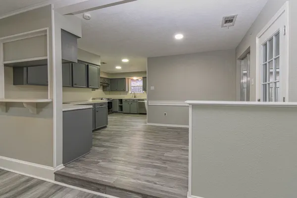a view of kitchen with wooden floor