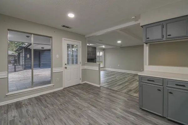 a view of a kitchen cabinets and wooden floor