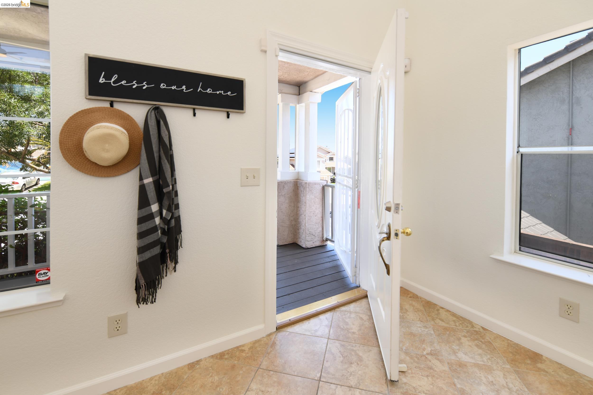 512 Burdick Drive Bay Point, CA 94565 - Photo 8 of 50 Entryway featuring tile flooring, white walls, and a white front door with a decorative glass insert