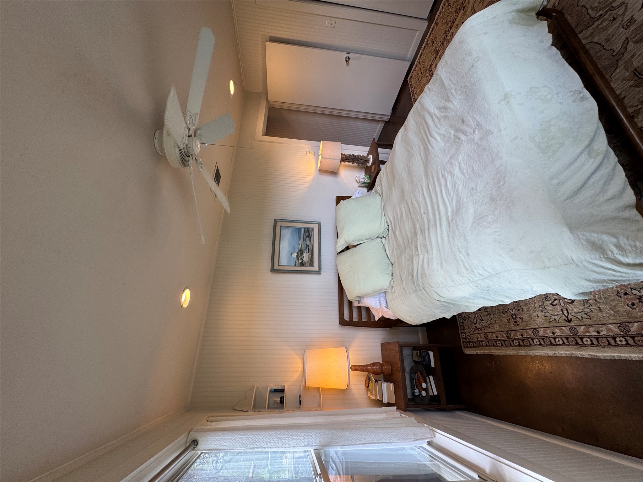 12501 Fitzhugh Road Austin, TX 78736 - Photo 24 of 40 Recessed lighting and a ceiling fan illuminate this well-appointed sleeping sanctuary.
