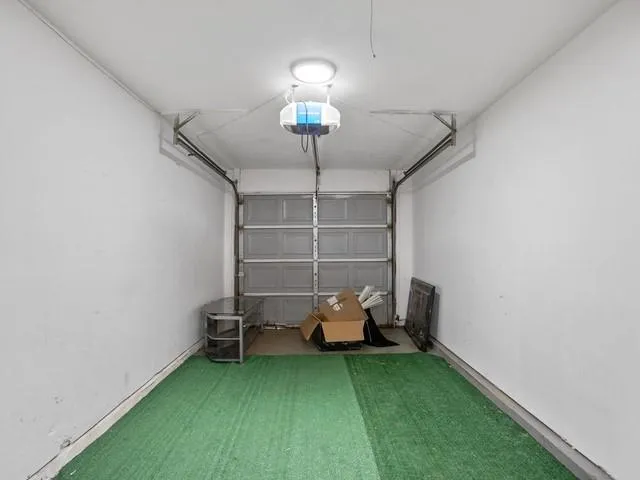 a bed room with a bed and a window