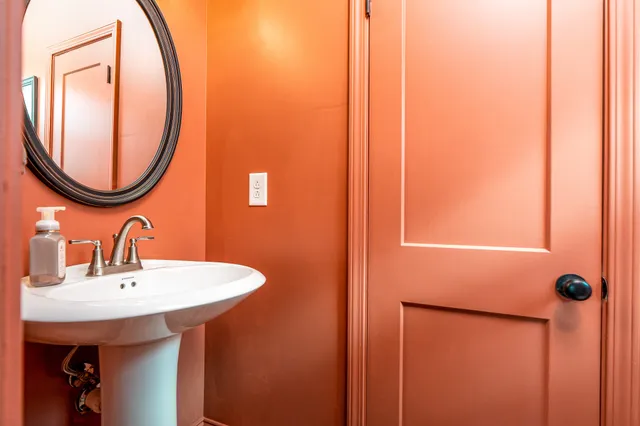 a bathroom with a sink and a mirror