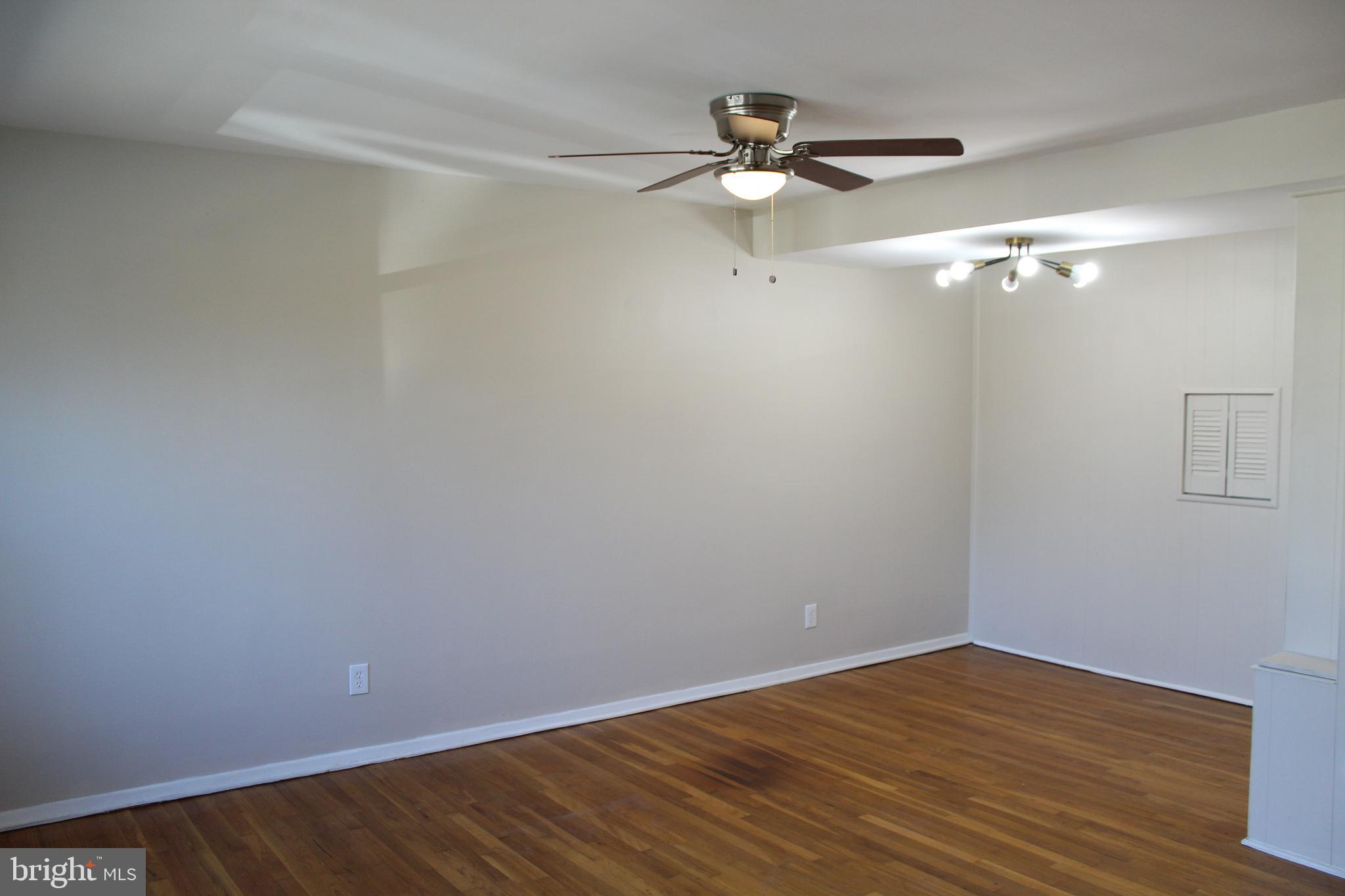 202 Cove Road Essex, MD 21221 - Photo 9 of 11 Hardwood floors, updated lighting