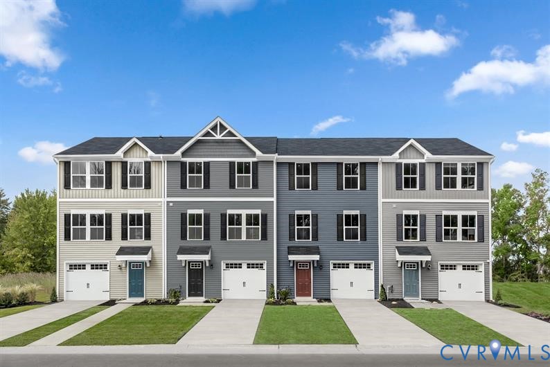 a front view of a building with a yard