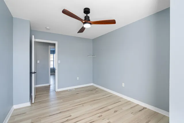 a white toilet sitting next to a bath tub