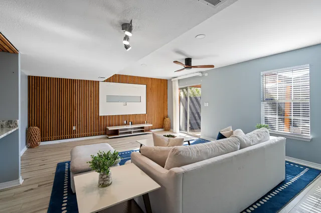a living room with furniture and a window
