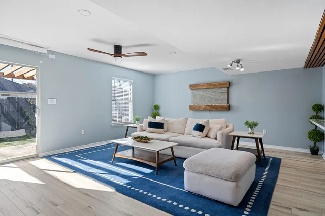 a bedroom with furniture and wooden floor