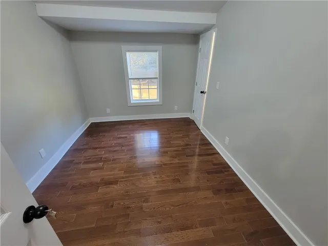 a view of an empty room and window