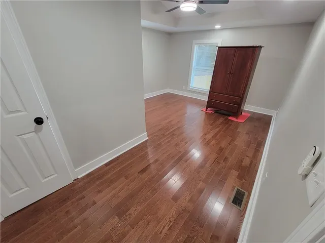 an entryway with wooden floor