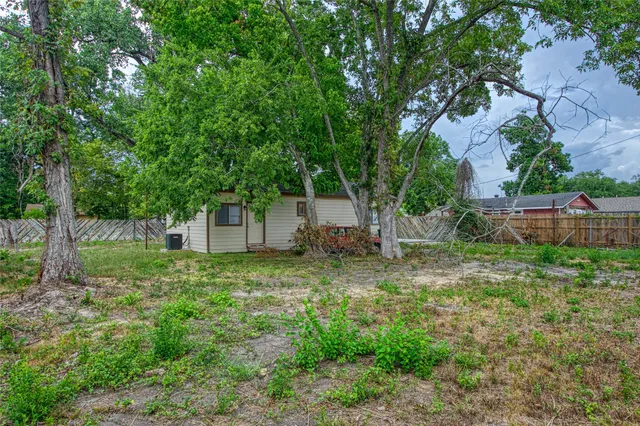 a fire hydrant in the middle of a field
