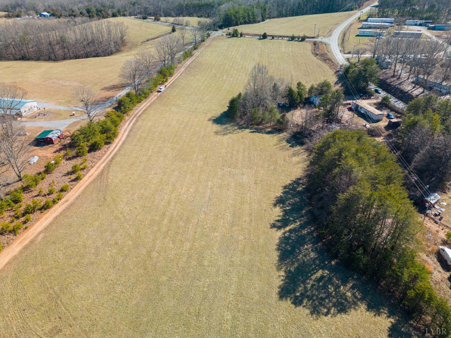 a view of a swimming pool with a yard