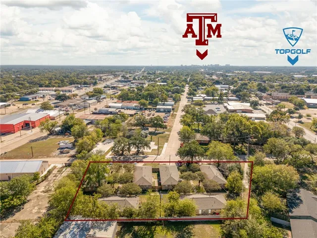 an aerial view of residential building and lake