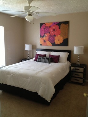 106 Hardy Street Bryan, TX 77801 - Photo 10 of 27 a bedroom with a bed and lamps