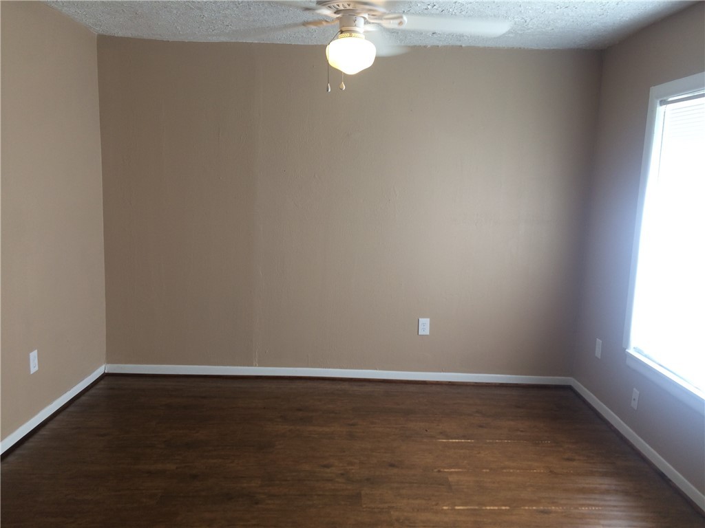 106 Hardy Street Bryan, TX 77801 - Photo 14 of 27 a view of a room with wooden floor and fan