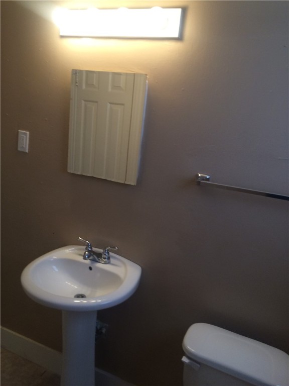 106 Hardy Street Bryan, TX 77801 - Photo 18 of 27 a bathroom with a sink a toilet and mirror