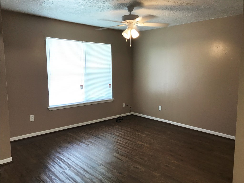 106 Hardy Street Bryan, TX 77801 - Photo 21 of 27 an empty room with wooden floor and windows