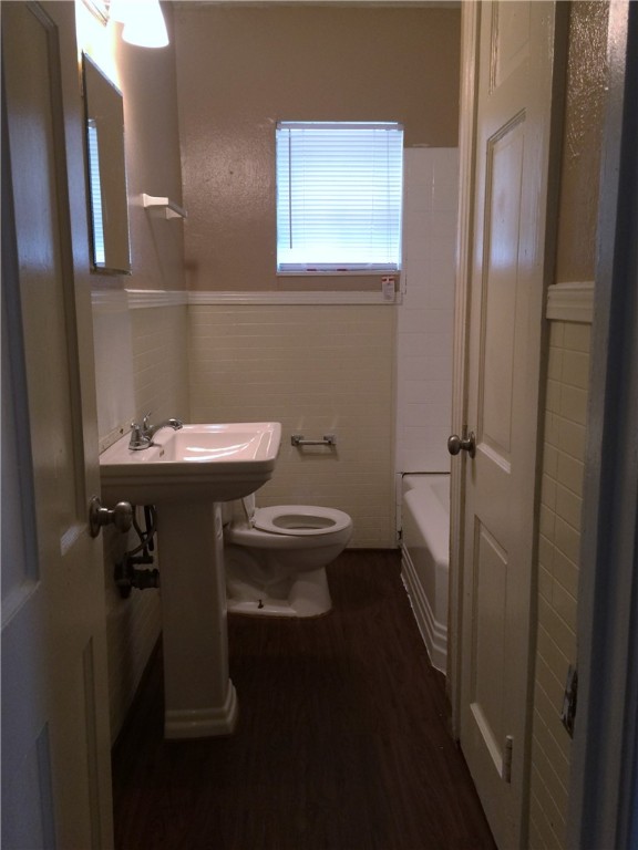 106 Hardy Street Bryan, TX 77801 - Photo 22 of 27 a bathroom with a sink toilet and a mirror