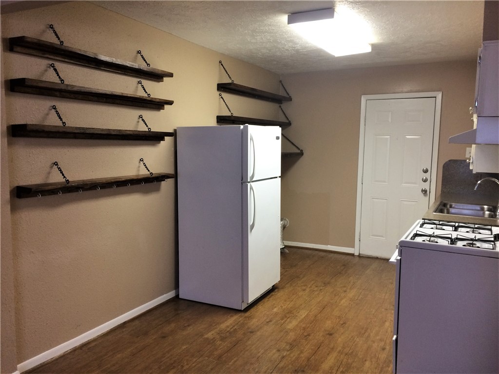 106 Hardy Street Bryan, TX 77801 - Photo 24 of 27 a view of room with wooden floor and cabinets