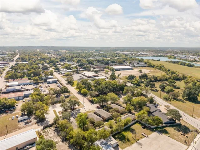 an aerial view of residential building and trees