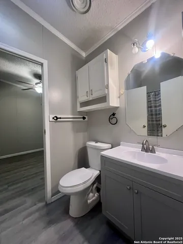 a view of an empty room with a fireplace