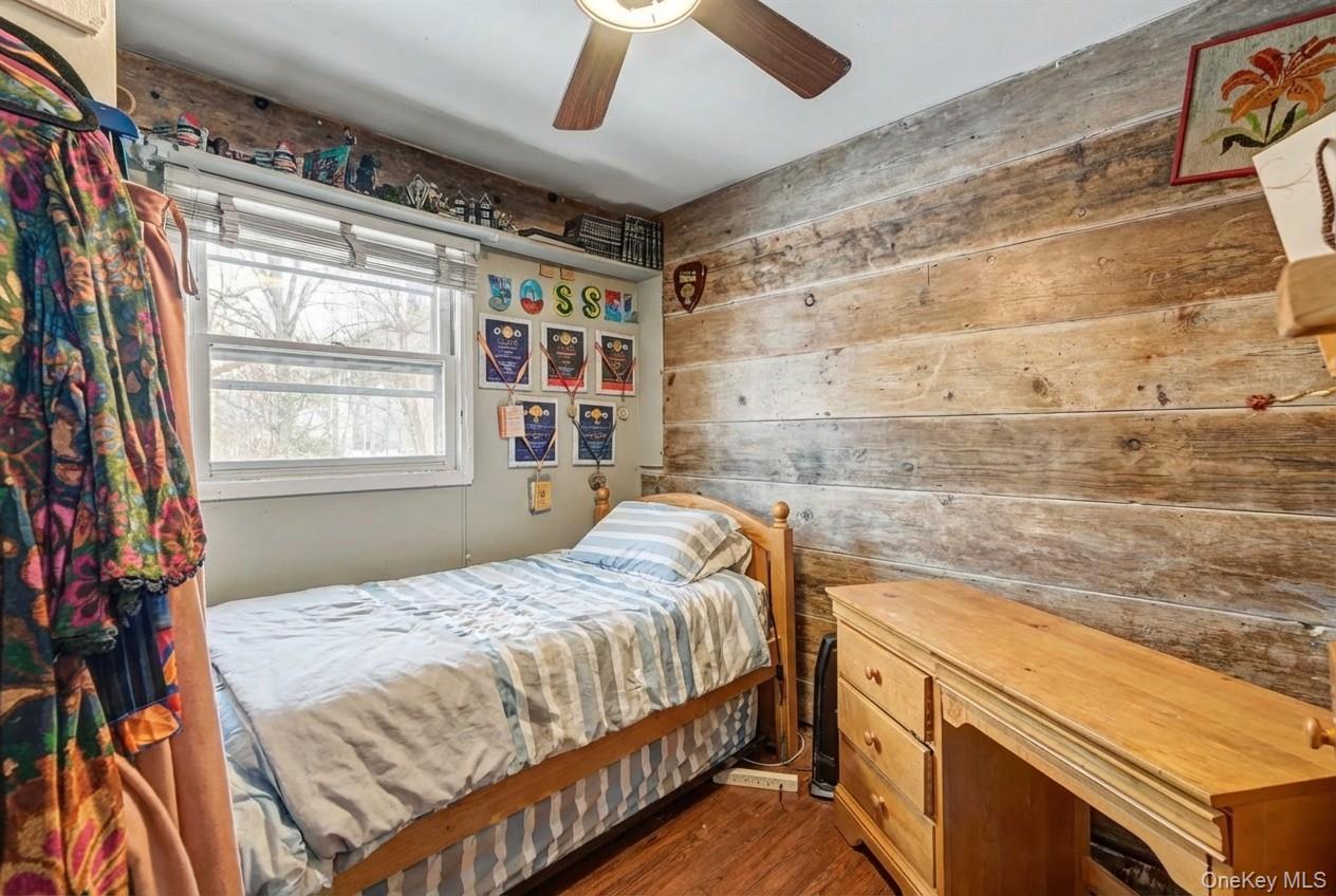 6 Kakiat Lane Spring Valley, NY 10977 - Photo 17 of 25 a bedroom with a bed and a dresser next to a window