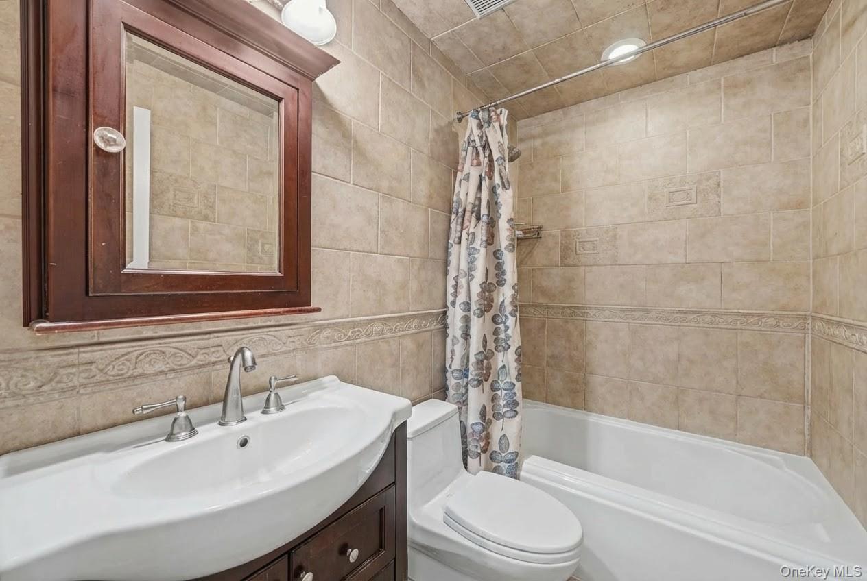 6 Kakiat Lane Spring Valley, NY 10977 - Photo 18 of 25 a bathroom with a sink a toilet and shower